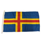 Gæsteflag fra Adela med Ålandsymbol, vist både forfra og bagfra.