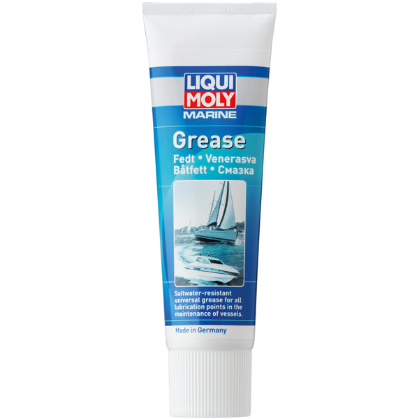 Liqui Moly Marine fedt patron placeret på en arbejdsbænk med bådudstyr.